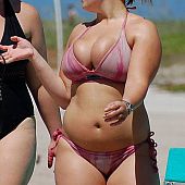 A breasty bikini gal undressing on the Rarawa Nudist.