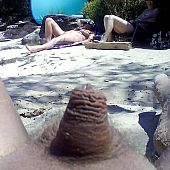 Consummate chicks sunbathes naked on the beach.