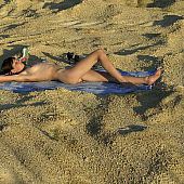 Angel lying naked beach.