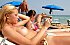 A bikini slut going topless on the Vera Playa. 11 pics