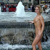 Sexy gal walks completly stripped down the city.
