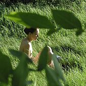 Stripped on the grass.