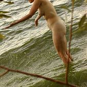Playing exposed water nude.