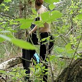 Undressing in the bushes.
